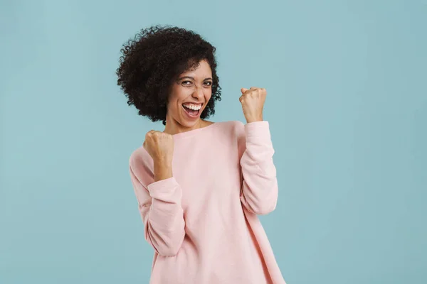 Black Young Woman Laughing While Making Winner Gesture Isolated Blue —  Fotos de Stock