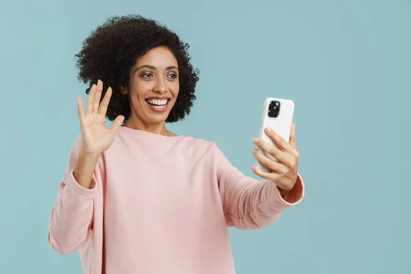 Young Black Woman Gesturing While Taking Selfie Cellphone Isolated Blue — Fotografia de Stock