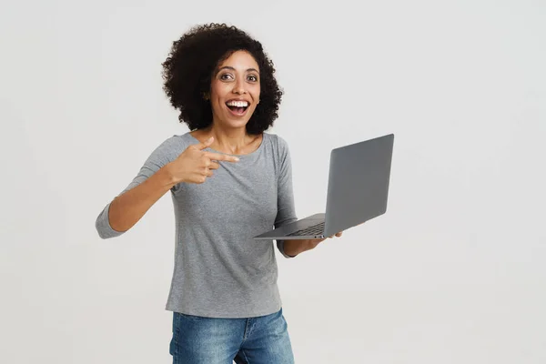Young Black Woman Smiling Pointing Finger Her Laptop Isolated White — Stockfoto