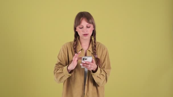 Smiling Blonde Woman Pigtails Talking Video Call Mobile Green Studio — Stock videók