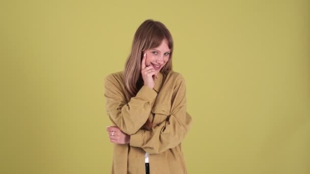 Shy Blonde Woman Looking Isolated Green Background Studio — Video Stock