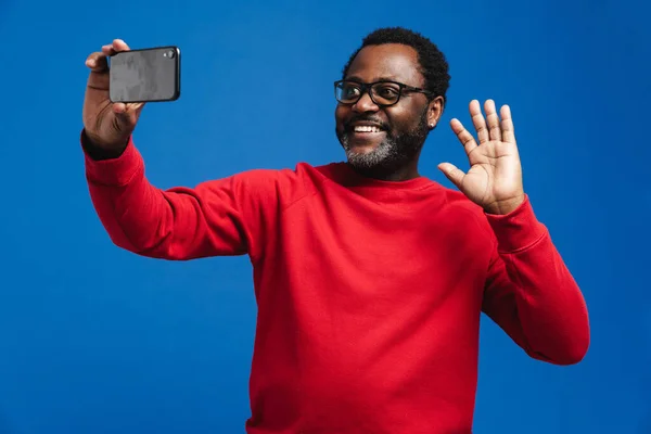 Black Man Eyeglasses Waving Hand While Taking Selfie Photo Isolated — Stock fotografie