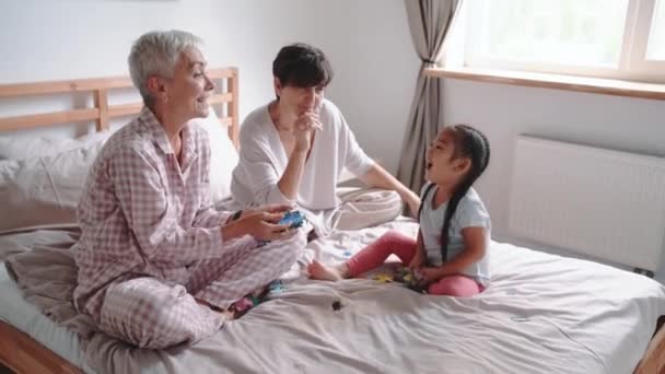 Funny Mature Lesbian Couple Talking Playing Puzzles Adopted Asian Daughter — Stock videók