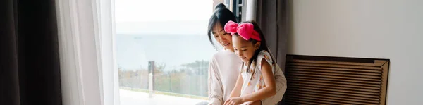 Asian Woman Her Daughter Talking While Standing Window Together Home — ストック写真