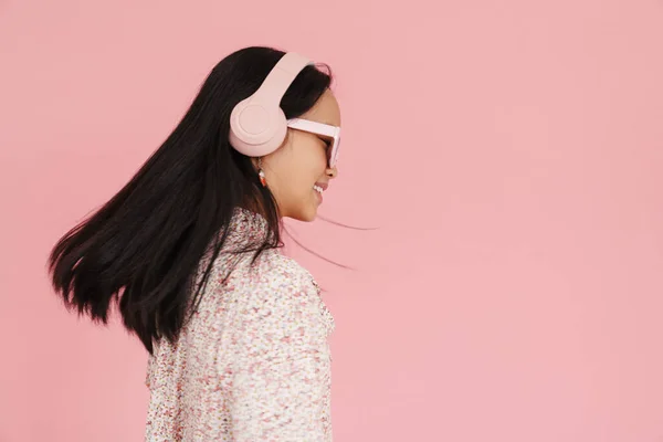 Asian Girl Dancing While Listening Music Headphones Isolated Pink Background — 图库照片