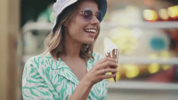 Positive Young Woman Wearing Panama Hat Eating Ice Cream While — Stockvideo