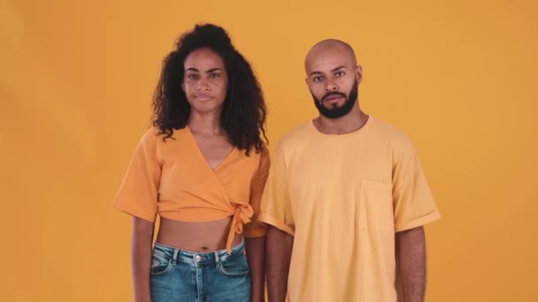 Displeased Hispanic Couple Disagreeing Something Showing Facepalm Gesture Yellow Studio — Vídeos de Stock