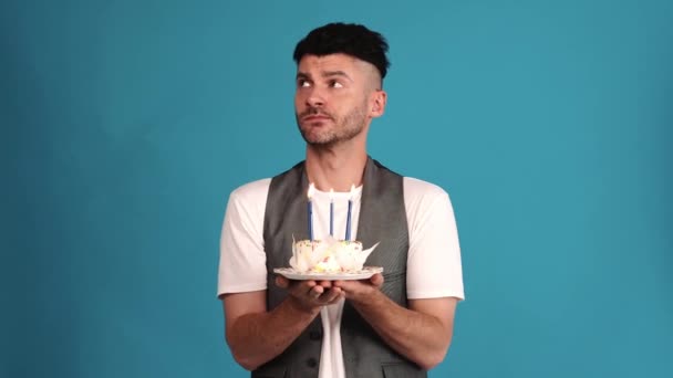 Upset Brunet Man Wearing Vest Shirt Looking Birthday Cake Blue — Stockvideo