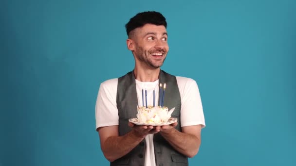 Smiling Brunet Man Wearing Vest Shirt Looking Birthday Cake Blue — Stockvideo