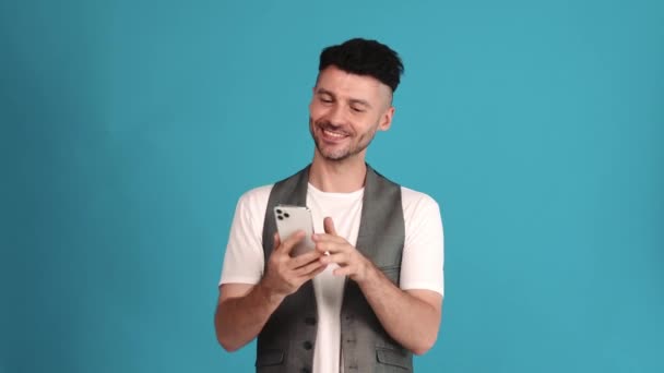 Positive Brunet Man Wearing Vest Shirt Talking Video Call Phone — Vídeos de Stock