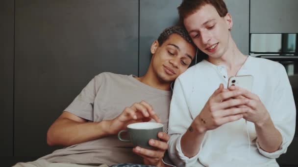 Relaxed Gay Couple Listening Music Headphones Together Kitchen Floor — Vídeo de Stock