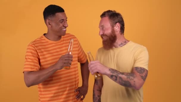 Positive Multinational Men Clink Drink Beer Yellow Studio — Vídeo de stock