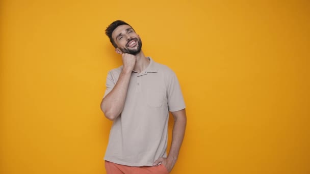 Meditative Brunet Man Wearing Shirt Thinking Something Yellow Studio — Stock video