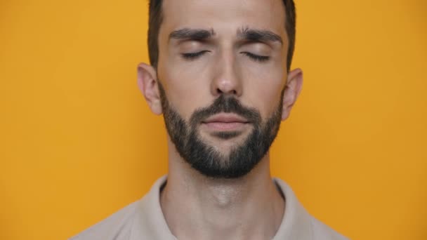 Cheerful Brunet Man Wearing Shirt Opening Eyes Camera Yellow Studio — Stock video