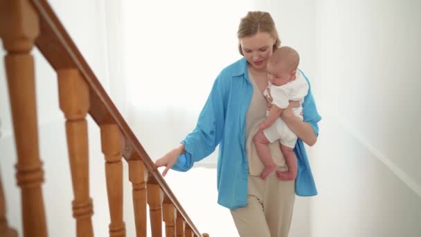 Pretty Blonde Mother Walks Stairs Her Small Child Her Arms — Wideo stockowe