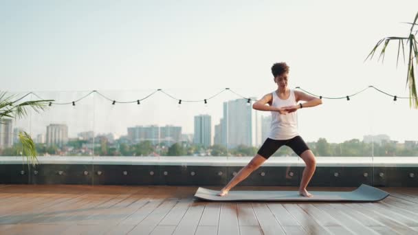 Pretty Curly Haired African Sporty Woman Stretching Her Legs While — Wideo stockowe