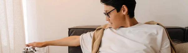 Asian Boy Eyeglasses Setting Alarm Clock While Resting Bed Home — Fotografia de Stock