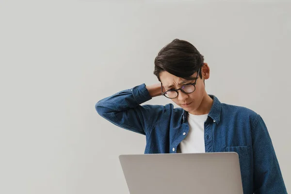 Asian Brunette Boy Wearing Eyeglasses Working Laptop Isolated White Background — Stockfoto