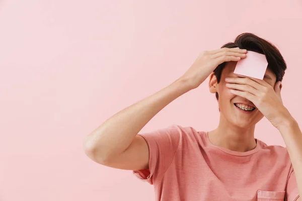 Asian Boy Laughing While Posing Sticker Forehead Isolated Pink Background — Stock Photo, Image