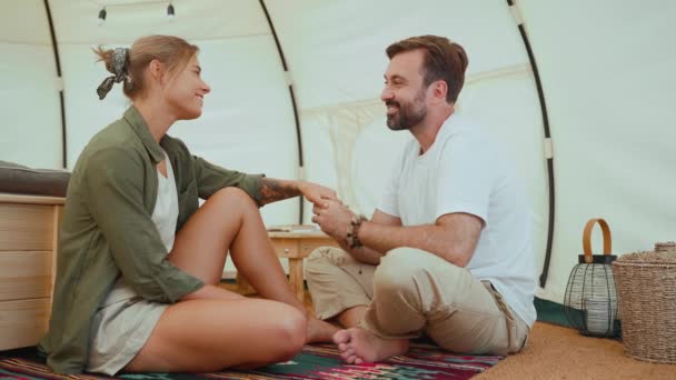 Smiling Blond Young Couple Holding Hands Talking While Sitting Tent — Stock Video
