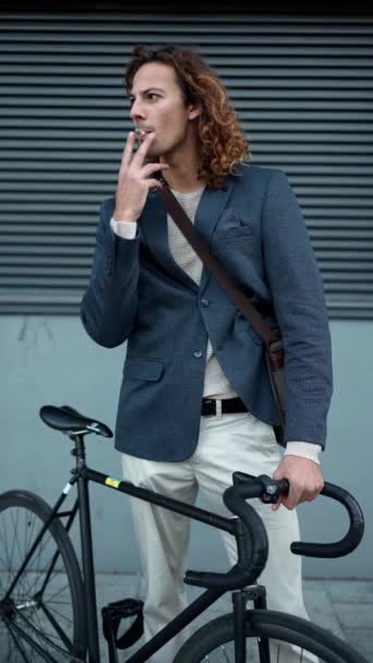 Handsome Curly Haired Man Wearing Jacket Smoking Looking Outdoors — Stock Video