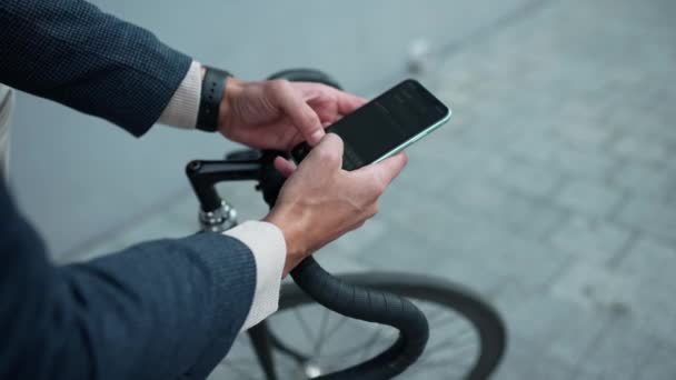 Man Wearing Jacket Texting Mobile While Sitting Bicycle Outdoors — Stock Video