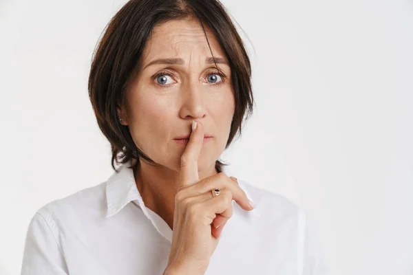 Mature Brunette Woman Showing Silence Gesture Camera Isolated White Background — Stock Photo, Image