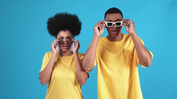 Surprised African Man Woman Take Glasses Look Each Other Blue — Stock Video