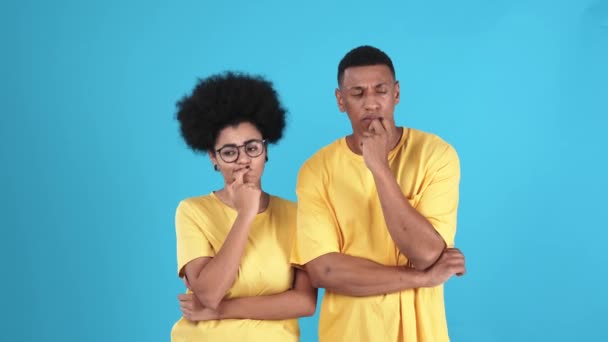 Confident African Couple Wearing Shirts Thinking Blue Studio — Stock Video