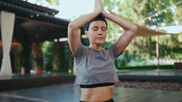 Cheerful Short Haired Woman Meditating Closed Eyes Outdoors — Stock Video