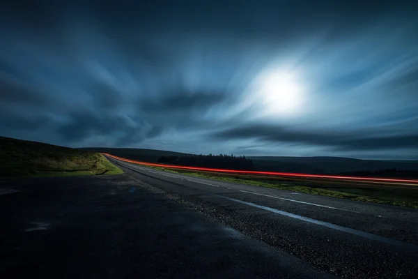 Blur night shoot of fast driving car — Stock Photo, Image