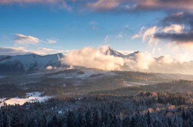 Tatra Mountains Snow Caped Peaks at Dramatic Sunset in Winter.