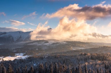 Tatra Mountains Snow Caped Peaks at Dramatic Sunset in Winter.