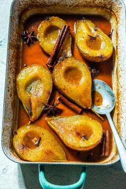 Sweet Ripe Pears Baked in Caramel. Hot Autumn Dessert.