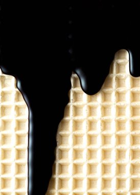Chocolate Glaze on Waffel. Food Texture Background.