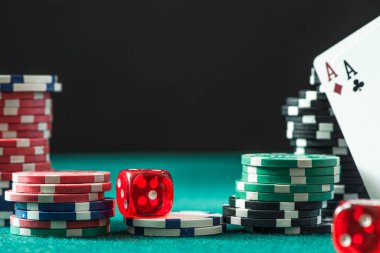 Poker Chips, Dices and Aces Cards on Casino Table. Gambling Background.