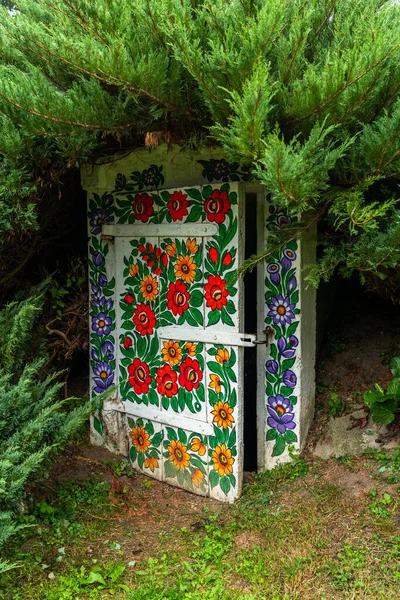 Painted doors in folklore flowers in Zalipie village, Poland.