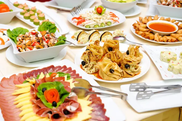 Table with delicious food — Stock Photo, Image