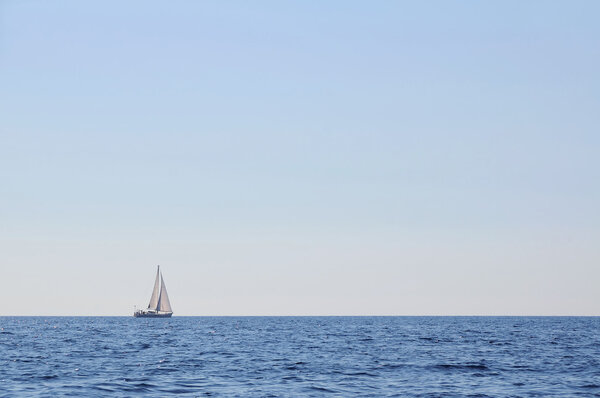 Sailboat alone at open sea