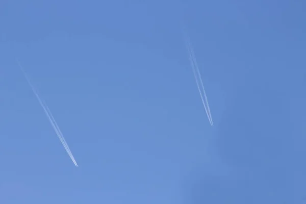Two planes high in sky
