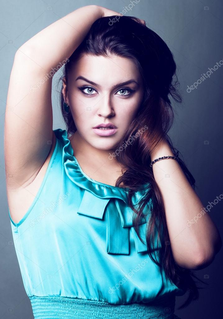 Sexy young plus size female model posing Photo by ©Moguchev 14553573