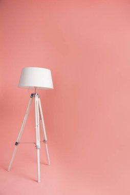 white floor lamp on pink background