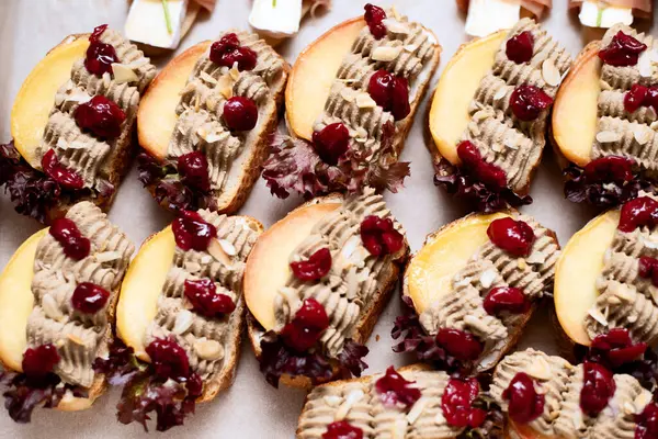 a lot of sandwiches with cherries on the whole frame