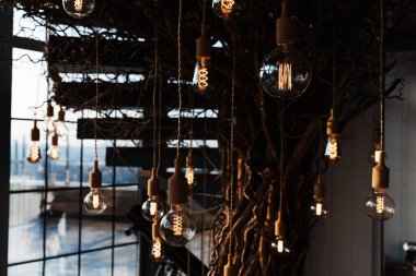 part of the interior, incandescent lamps of various shapes on the background of the stairs