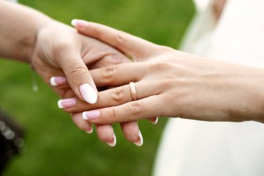 Diamond jewelery. Diamond ring on the finger of young lady.