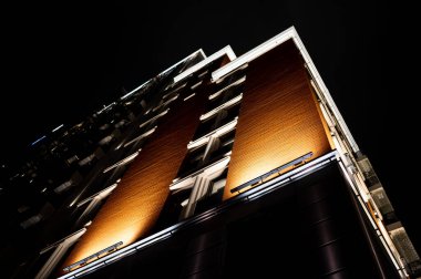 high-rise residential buildings from the bottom up against the blue evening starry sky. Kyiv, Ukraine, October 15, 2019