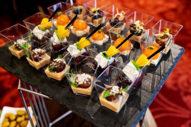 Canape appetizers with grape and DorBlu cheese. DorBlu Cheese with grape on skewers. Canapes for the holiday.