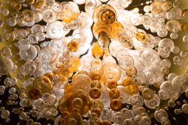 round lamps on long cords, conceptual chandelier