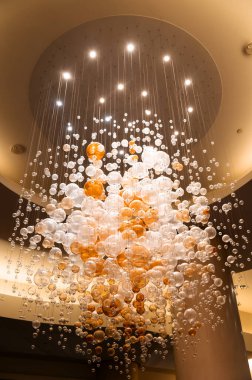 round lamps on long cords, conceptual chandelier