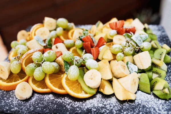 assorted fresh cut fruits on a tray